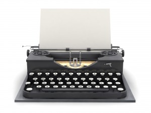 Retro typewriter and blank sheet